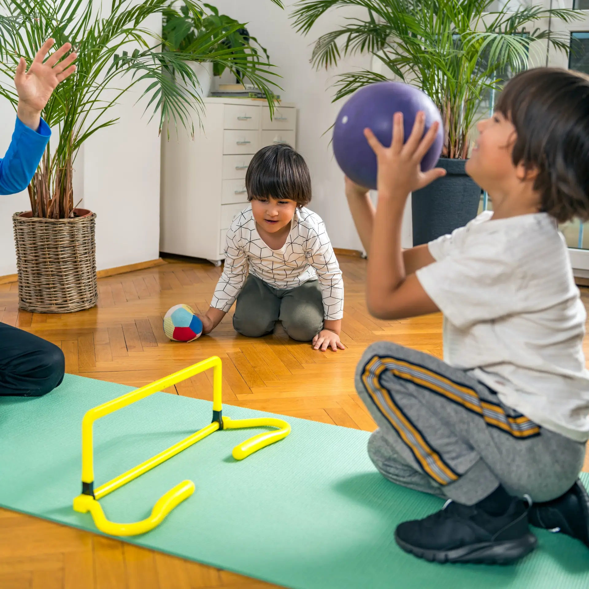 Children Playing with Ball Indoors